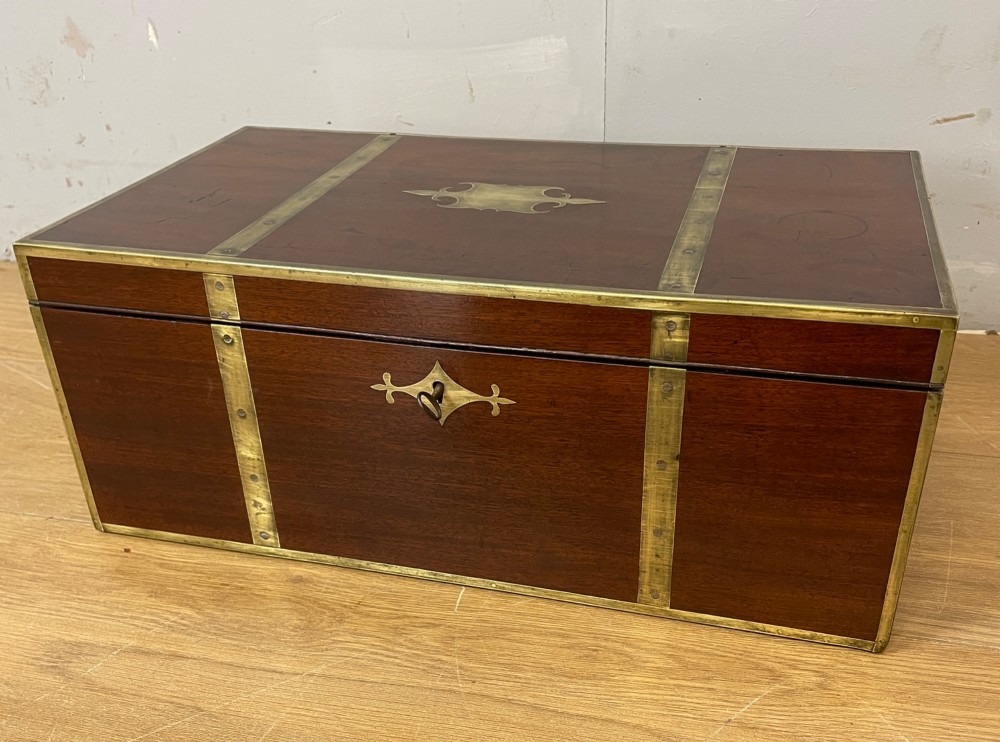 A 19th-century mahogany campaign writing slope featuring brass corner mounts, candle holders, and a gold-tooled burgundy leather writing surface. View II