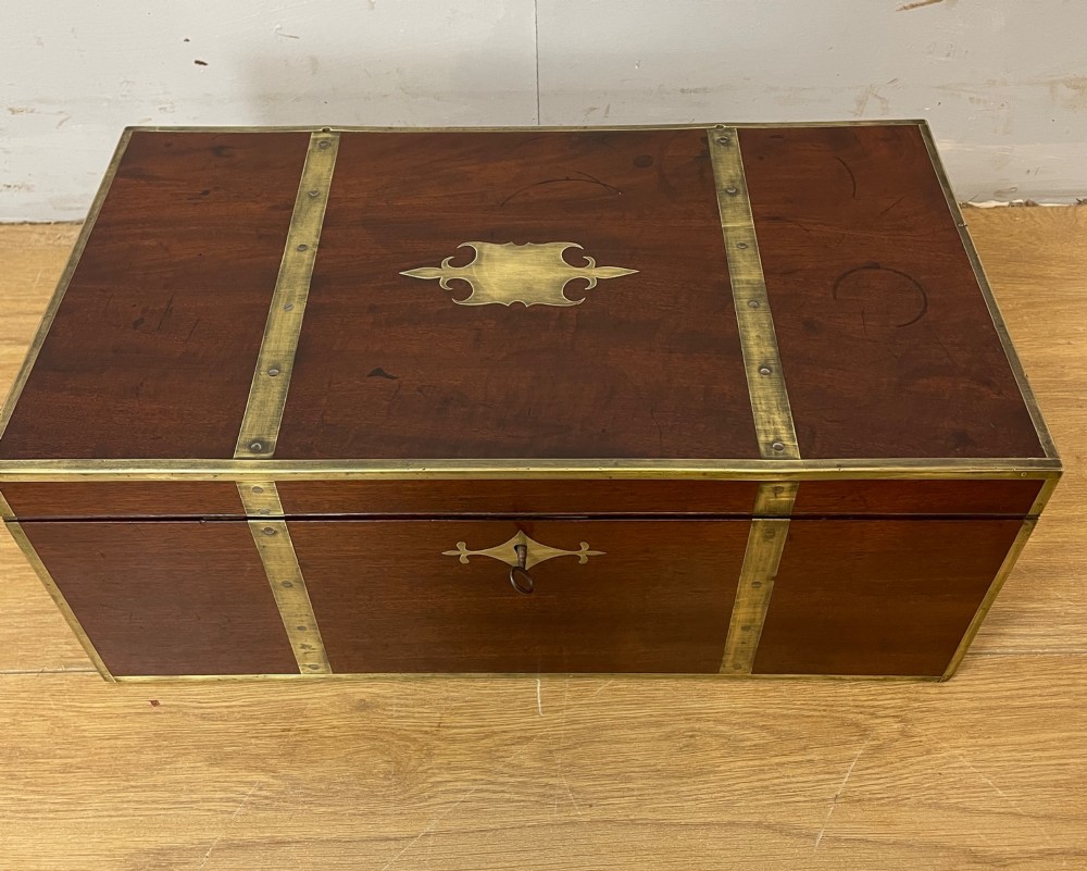 A 19th-century mahogany campaign writing slope featuring brass corner mounts, candle holders, and a gold-tooled burgundy leather writing surface. View III