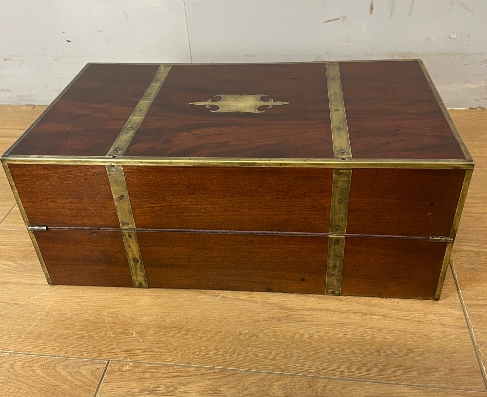 A 19th-century mahogany campaign writing slope featuring brass corner mounts, candle holders, and a gold-tooled burgundy leather writing surface. View XIII