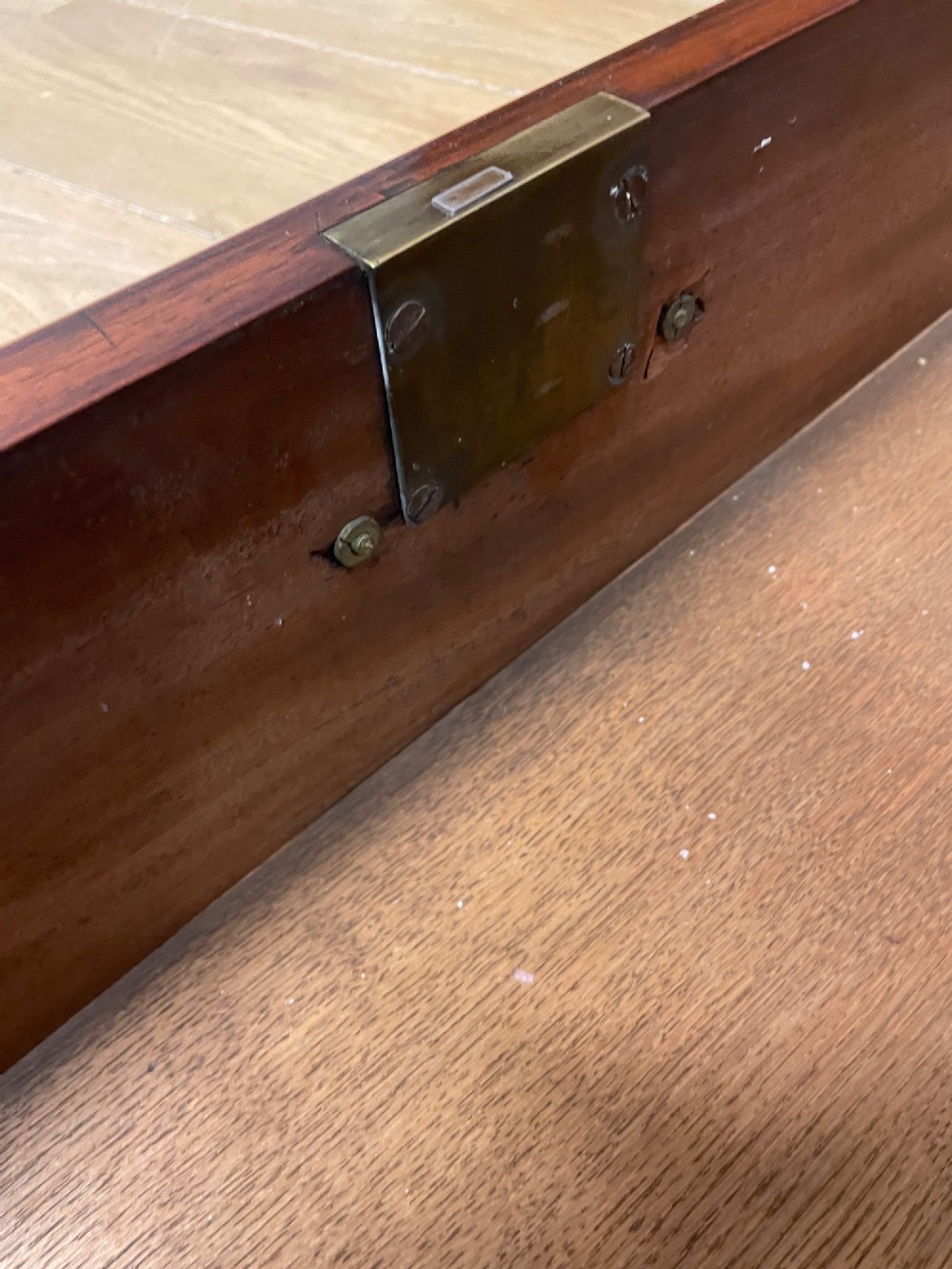 A late 18th-century mahogany chest on chest featuring two short drawers over six long drawers with brass handles and bracket feet. View XII