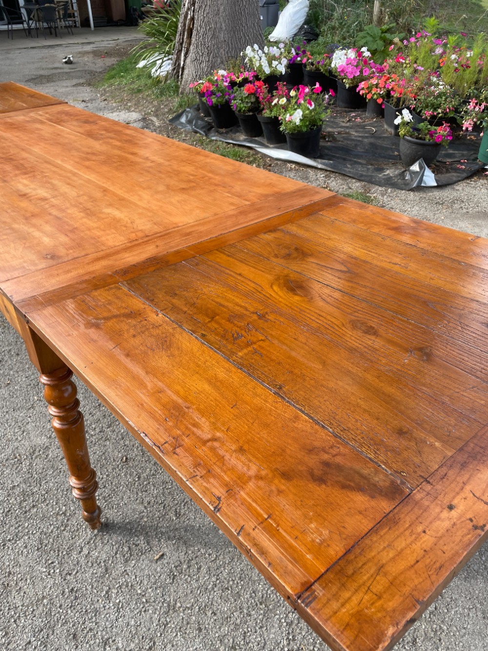 A 19th-century French cherrywood extending dining table featuring turned legs and a polished rectangular top. View VIII