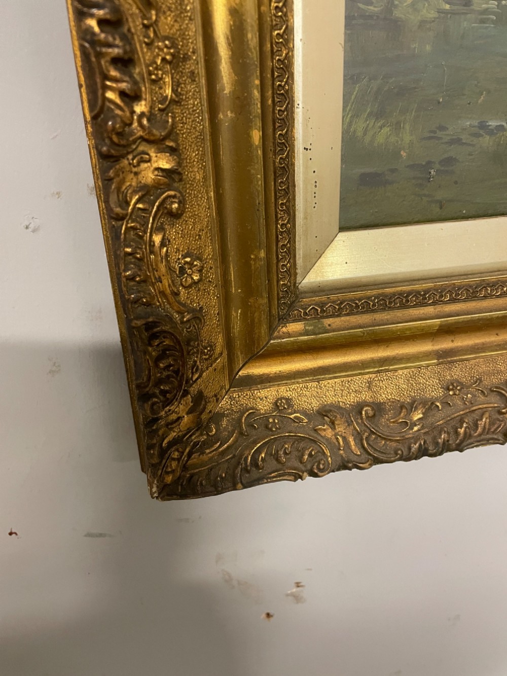 A pair of vertical late 19th-century oil paintings depicting green river and woodland landscapes in ornate gilded frames. View VIII