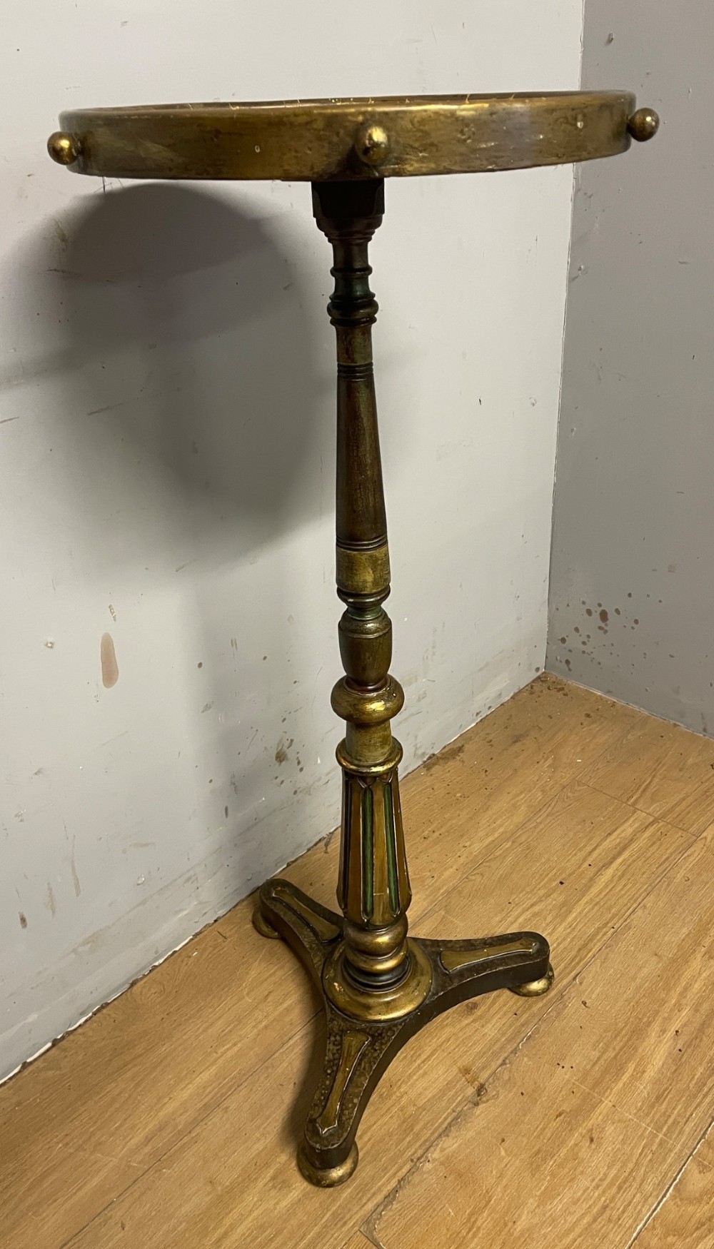 A 19th-century gilt and ebonised torchere stand featuring a circular needlework top, a turned column stem, and tripod feet. View III