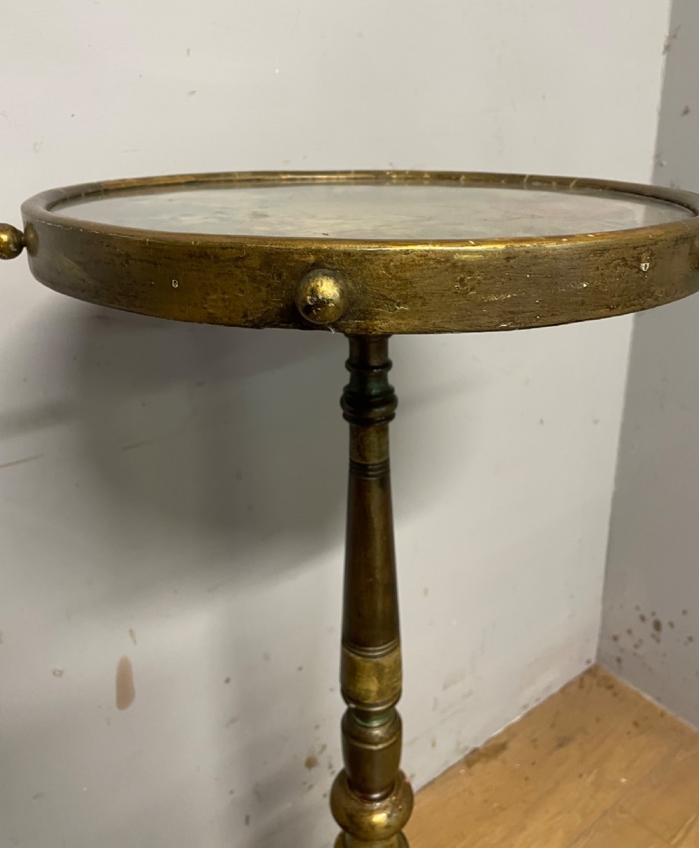 A 19th-century gilt and ebonised torchere stand featuring a circular needlework top, a turned column stem, and tripod feet. View IV