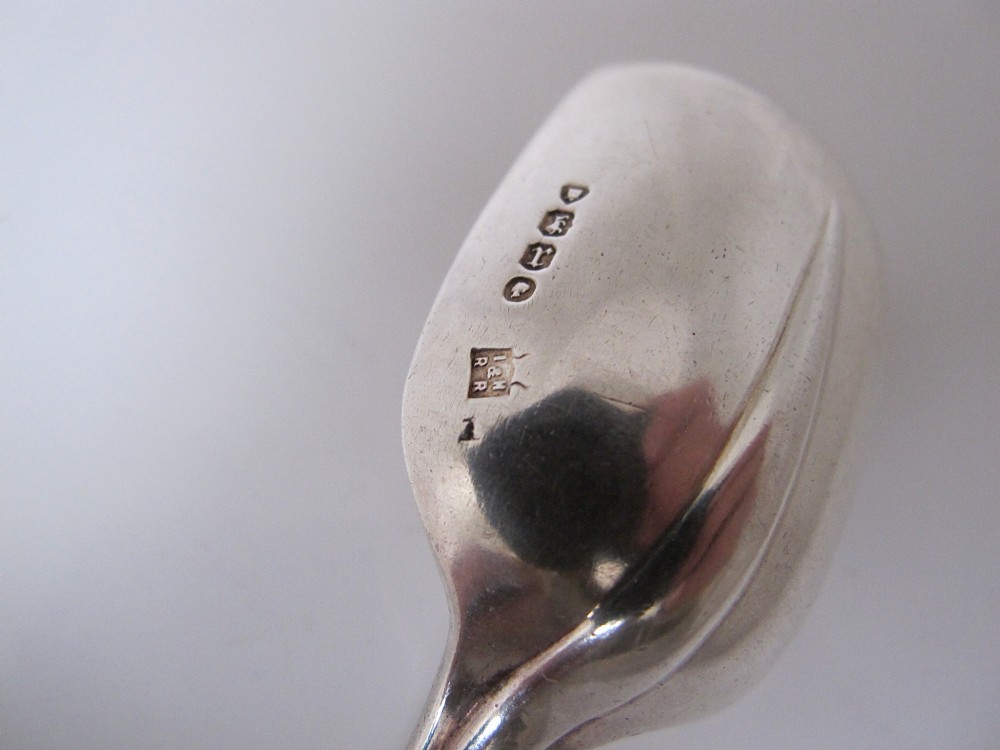 A Victorian sterling silver jam spoon featuring a shovel-shaped rectangular bowl and a decorated Hanoverian pattern handle with scroll terminal. View VI