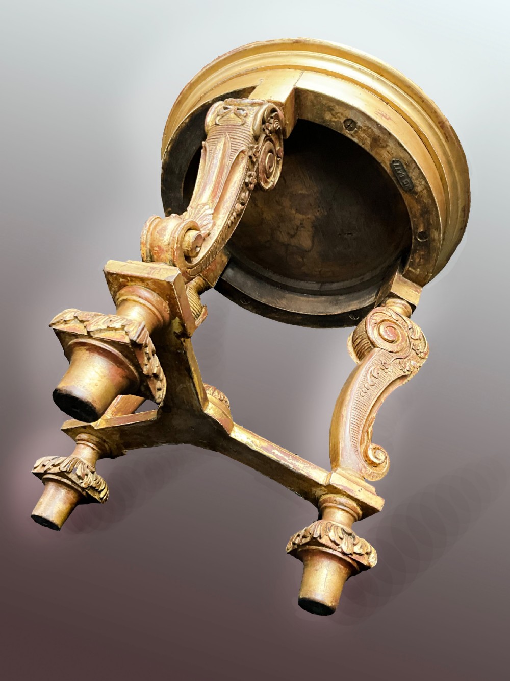 A late nineteenth-century circular giltwood urn stand featuring carved scroll legs, an X-form stretcher, and a dished circular top. View III