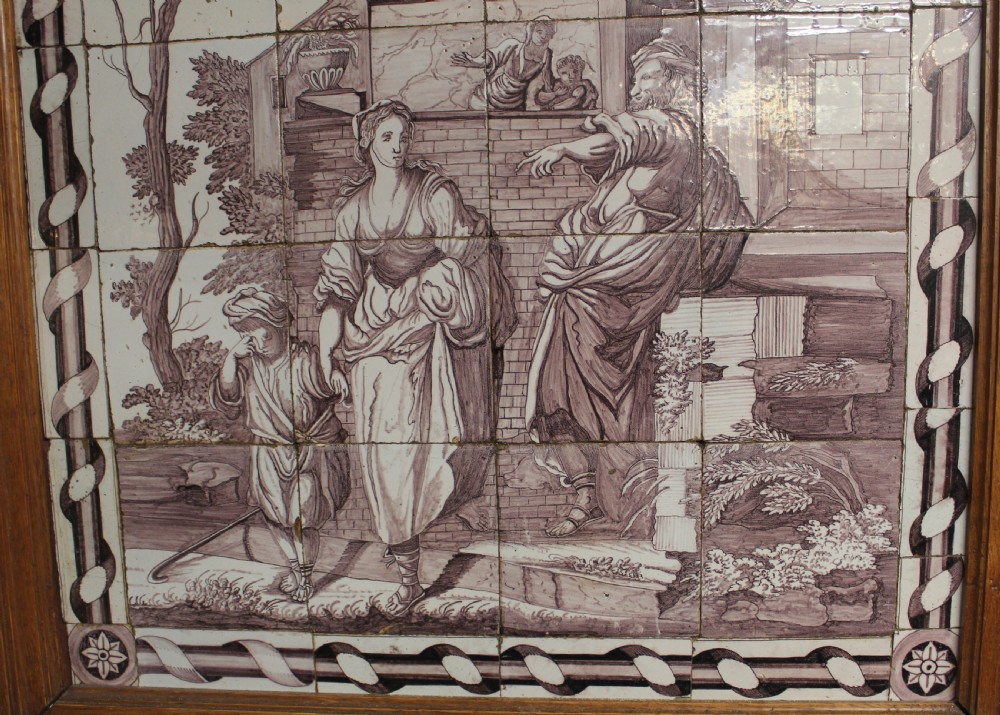A framed multi-tile ceramic panel hand-painted in manganese monochrome tones featuring a classical scene with figures in front of architectural ruins. View III