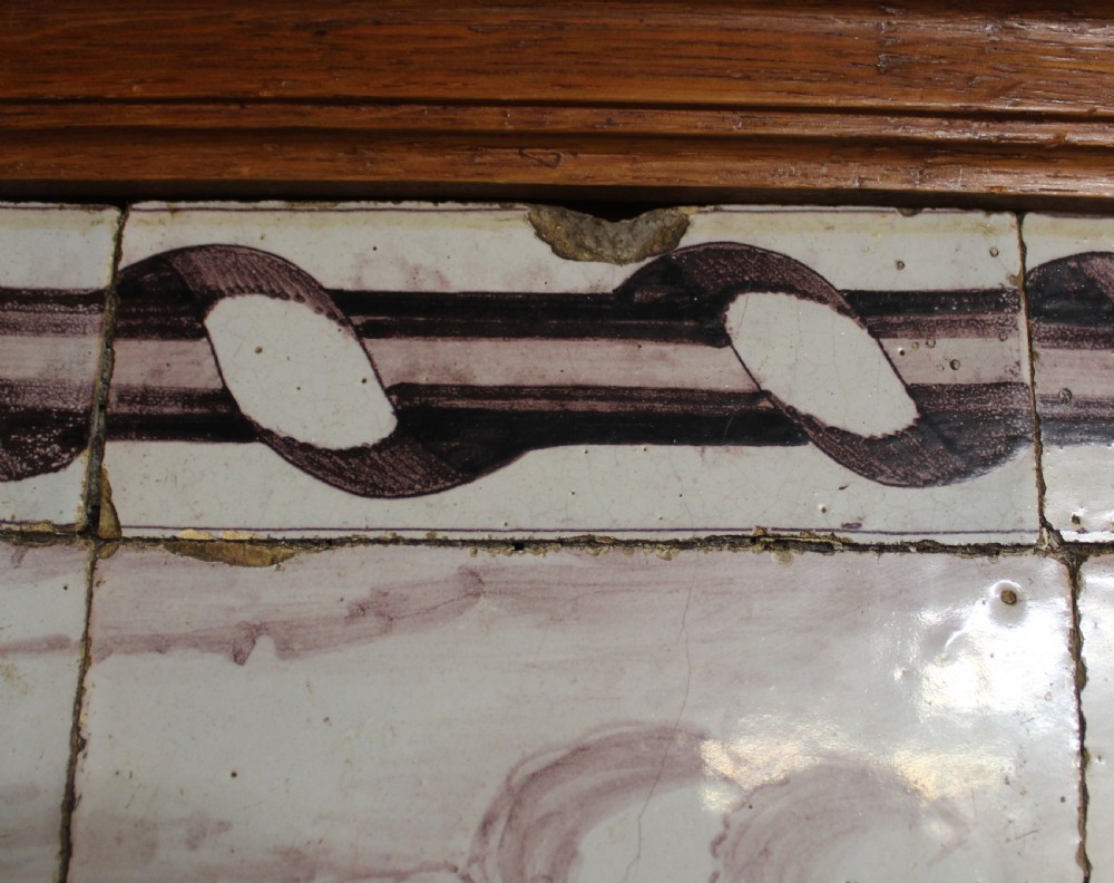 A framed multi-tile ceramic panel hand-painted in manganese monochrome tones featuring a classical scene with figures in front of architectural ruins. View IV