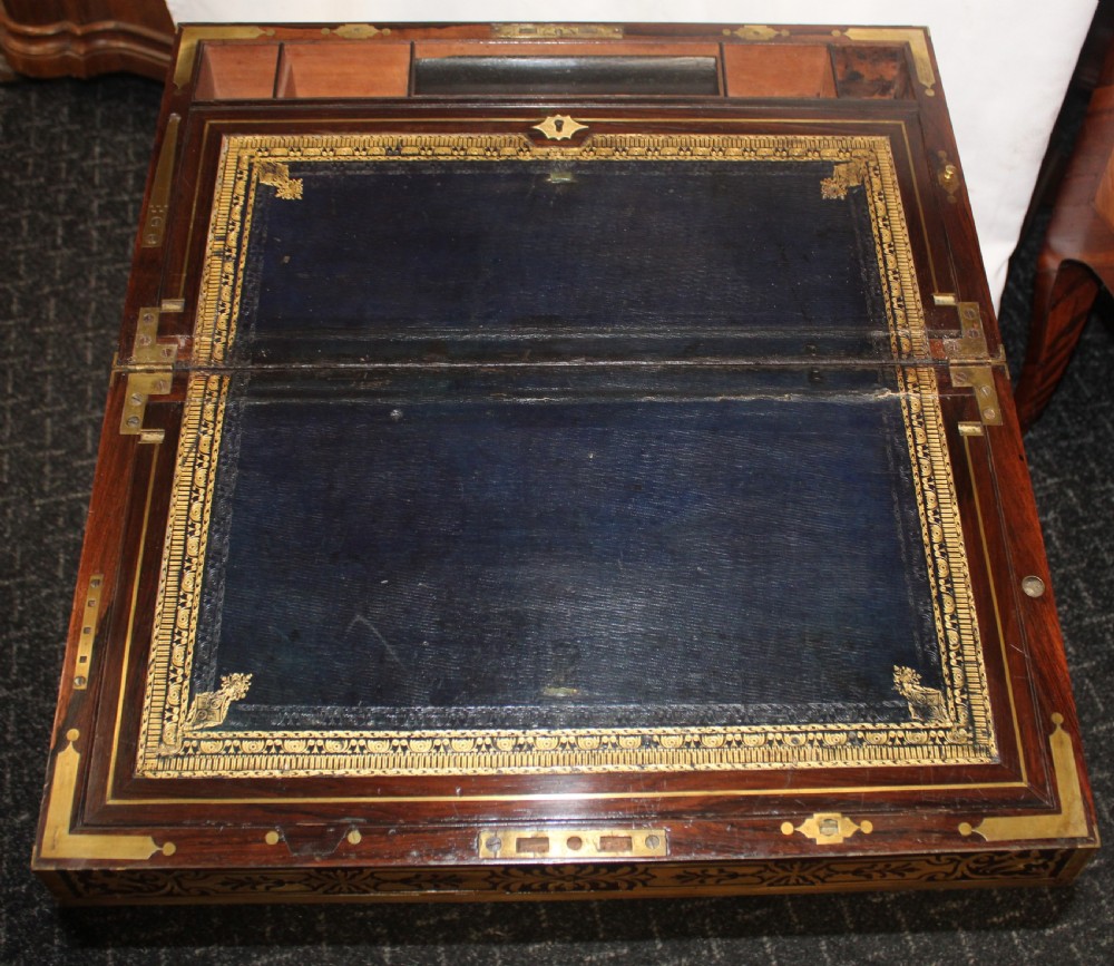 An antique brass and tortoiseshell Boulle work writing box mounted on a dark rosewood stand with tapered square legs. View II