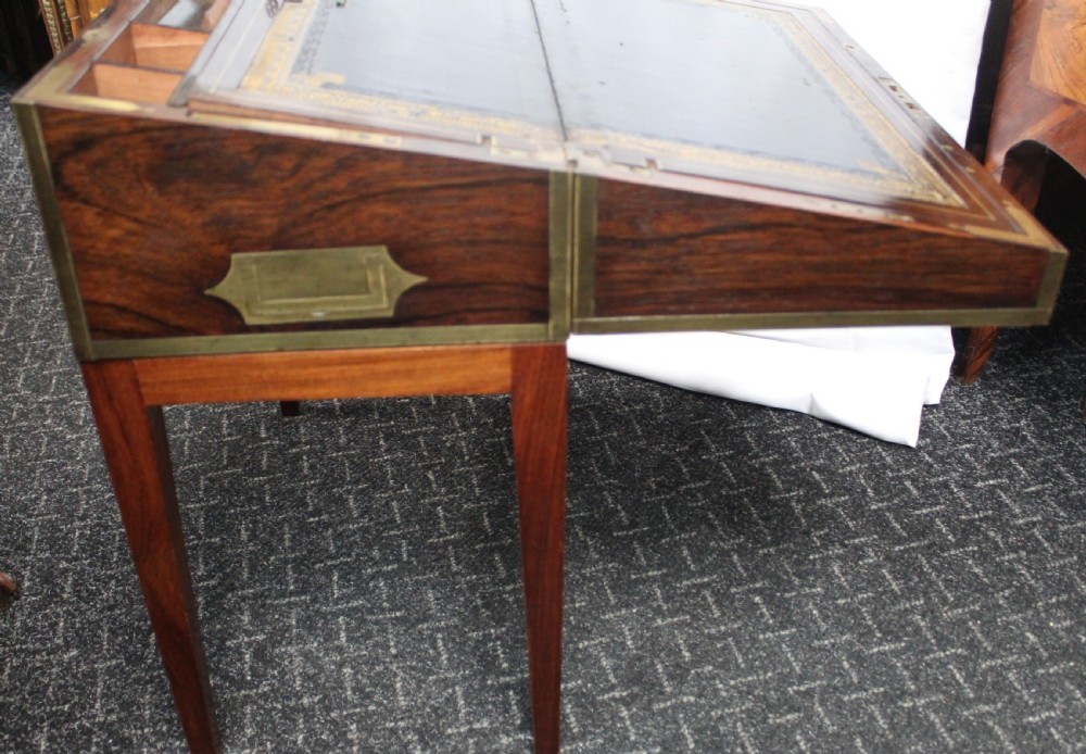 An antique brass and tortoiseshell Boulle work writing box mounted on a dark rosewood stand with tapered square legs. View III