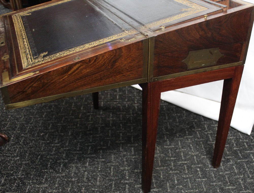 An antique brass and tortoiseshell Boulle work writing box mounted on a dark rosewood stand with tapered square legs. View IV