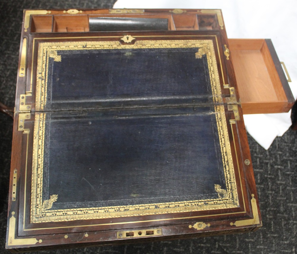 An antique brass and tortoiseshell Boulle work writing box mounted on a dark rosewood stand with tapered square legs. View V