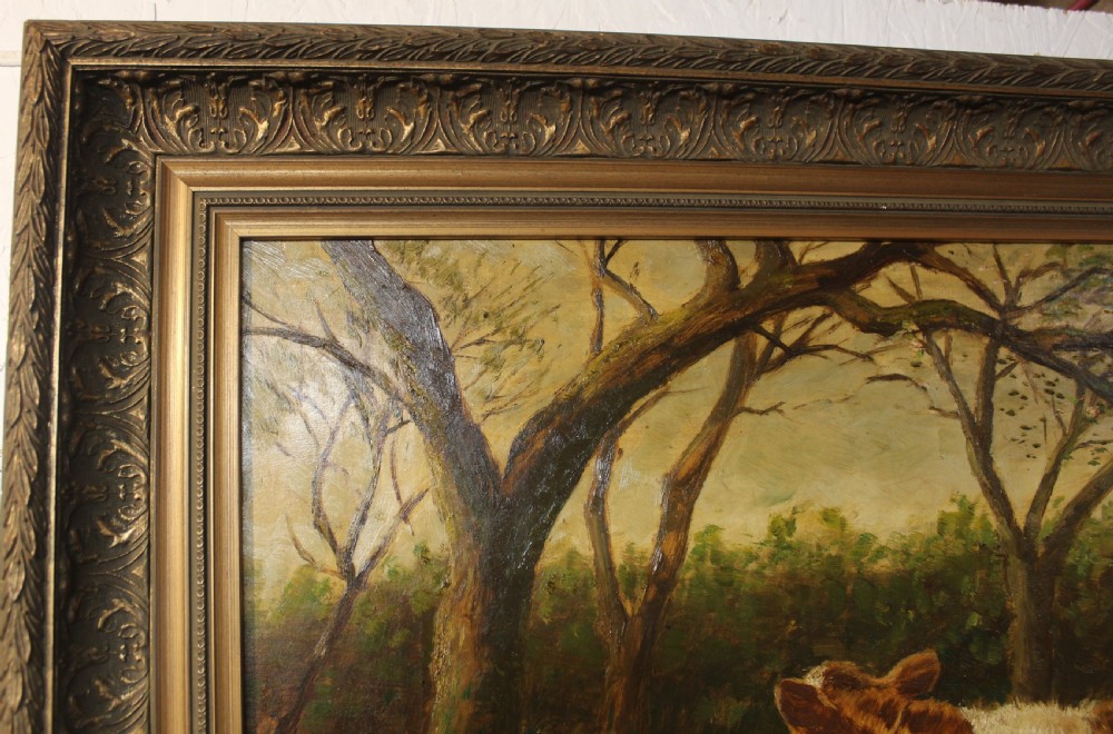 An oil painting on canvas depicting a brown and white calf standing in a green field surrounded by trees, housed within an ornate gilded frame. View II