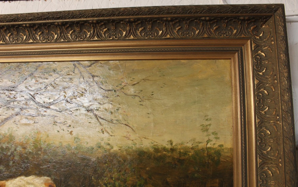 An oil painting on canvas depicting a brown and white calf standing in a green field surrounded by trees, housed within an ornate gilded frame. View III