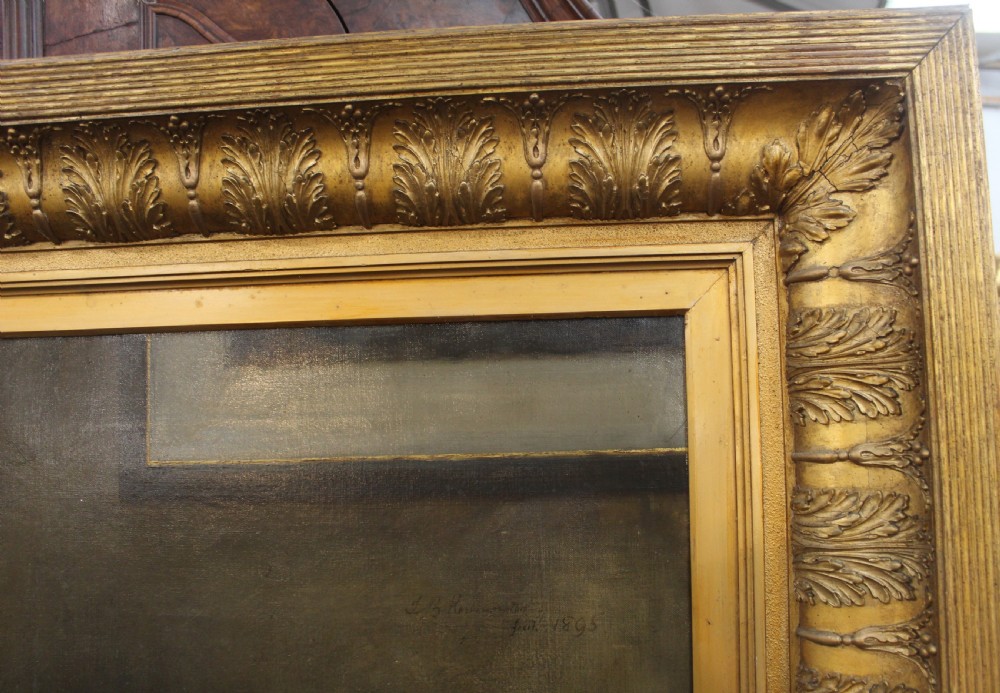 A large antique oil painting depicting two gentlemen in dark suits examining documents near a desk, set in an ornate gilded frame. View VI