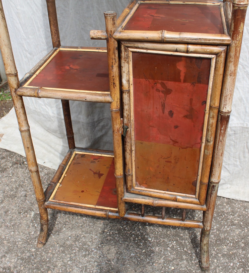 A Victorian bamboo shelving unit featuring a pagoda canopy top, open display tiers, and a small lacquered lower cabinet. View III