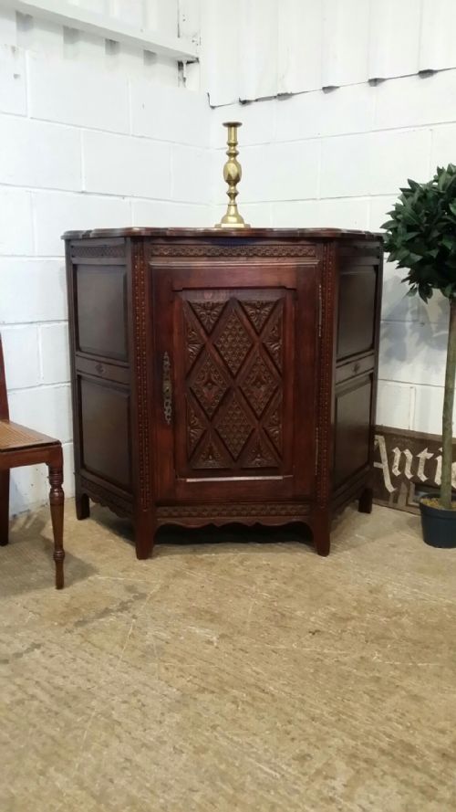 Antique Late 19th Century French Provincial Carved Oak Canted Credence Cupboard