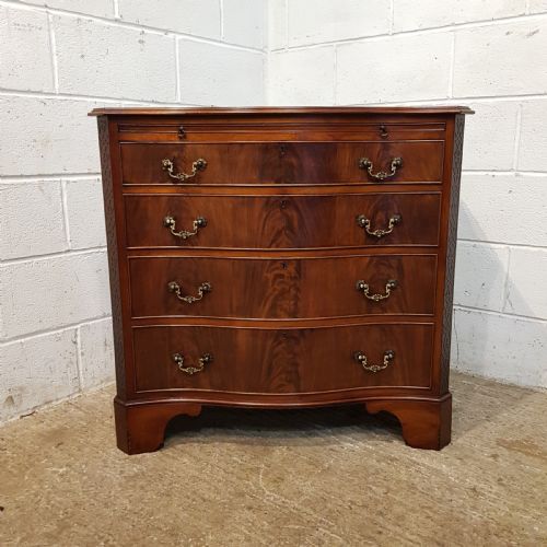 fig 2. ANTIQUE MAHOGANY SERPENTINE FRONT CHEST OF DRAWERS WITH BRUSHING SLIDE C1920