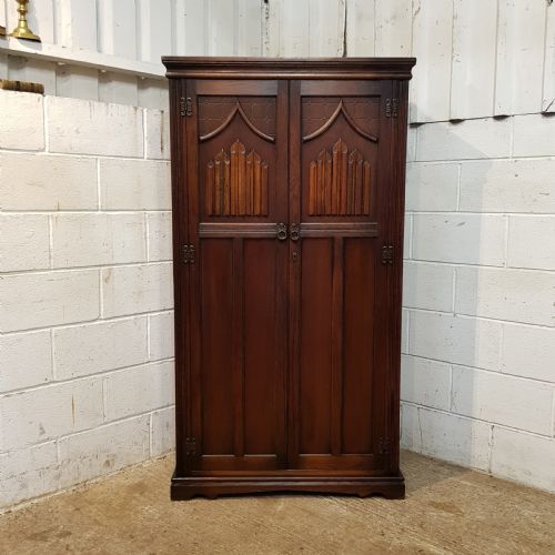 fig 2. ANTIQUE CARVED OAK FITTED GENTS WARDROBE C1920