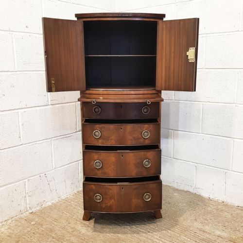 fig 1. ANTIQUE GENTS MAHOGANY BOW FRONT TALL BOY WITH BRUSHING SLIDE C1920