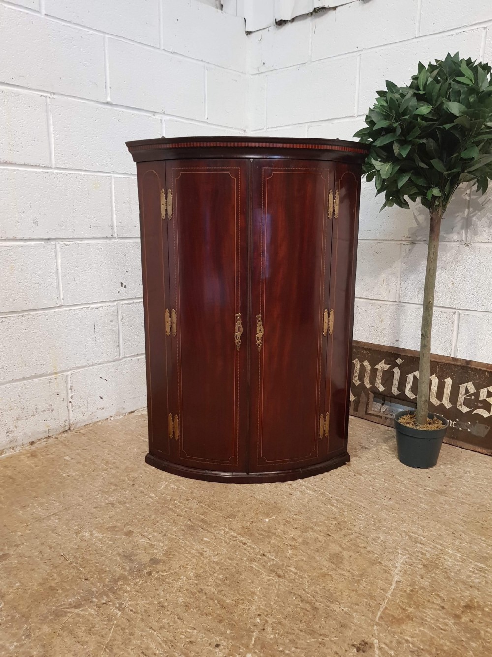 ANTIQUE REGENCY INLAID MAHOGANY BOW FRONT CORNER CUPBOARD C1820