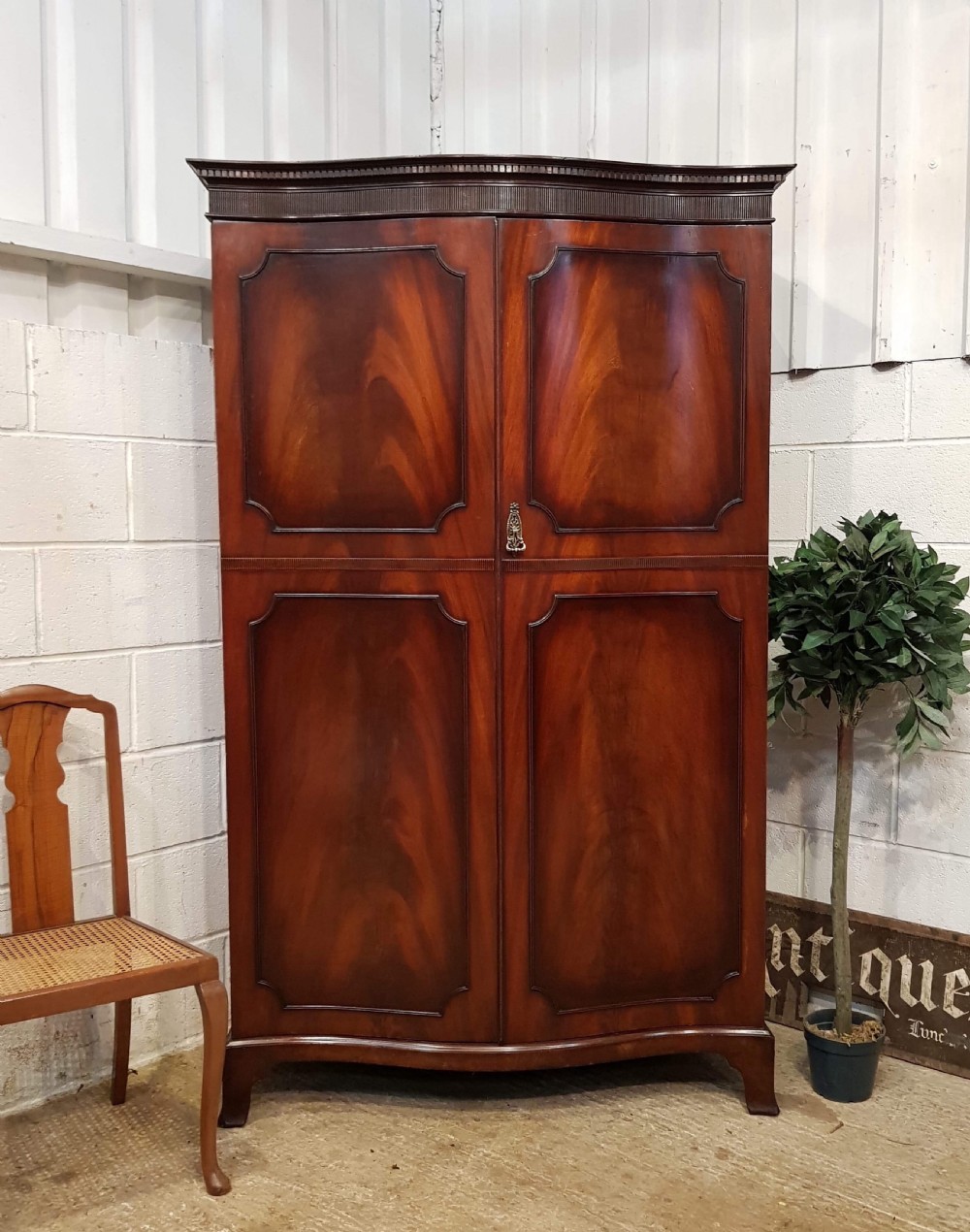 ANTIQUE EDWARDIAN FLAMED MAHOGANY SERPENTINE SHAPED DOUBLE WARDROBE C1900