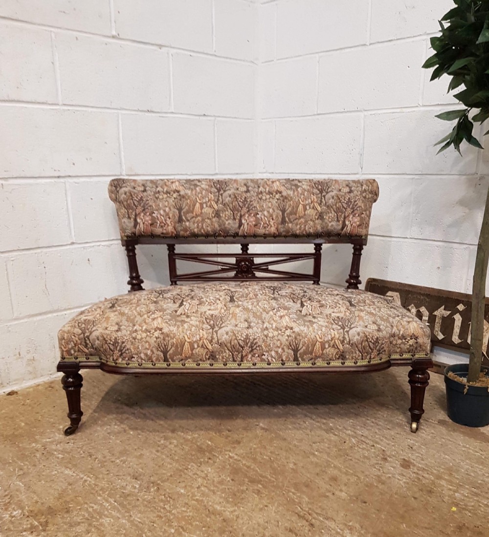 ANTIQUE SMALL FRENCH MAHOGANY SERPENTINE SHAPED SOFA C1900