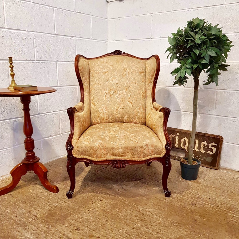 ANTIQUE FRENCH WALNUT FRAMED WING BACK ARMCHAIR C1900