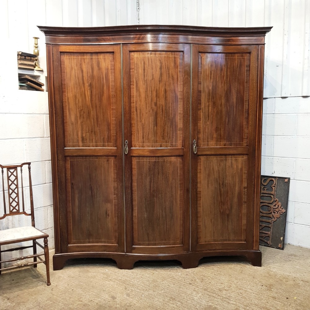 ANTIQUE EDWARDIAN MAHOGANY SERPENTINE SHAPE TRIPLE WARDROBE C1900