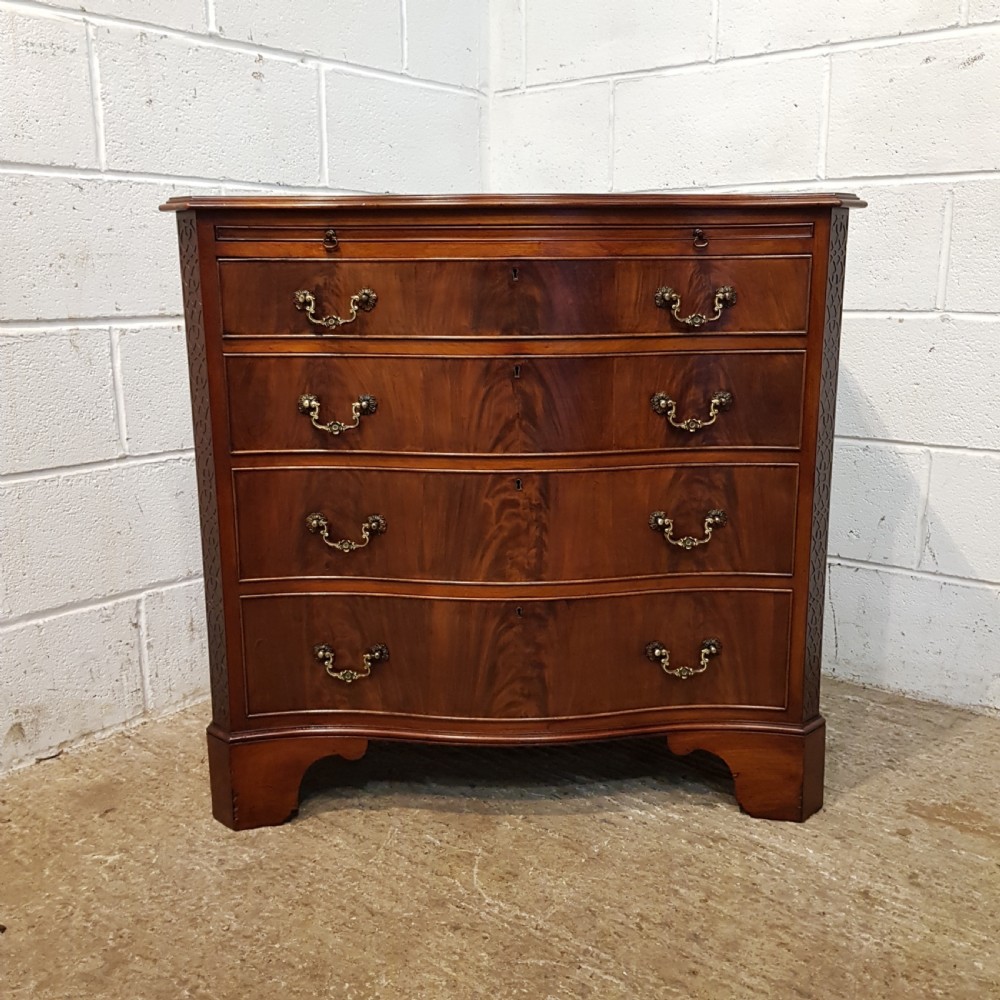 ANTIQUE MAHOGANY SERPENTINE FRONT CHEST OF DRAWERS WITH BRUSHING SLIDE C1920 View III