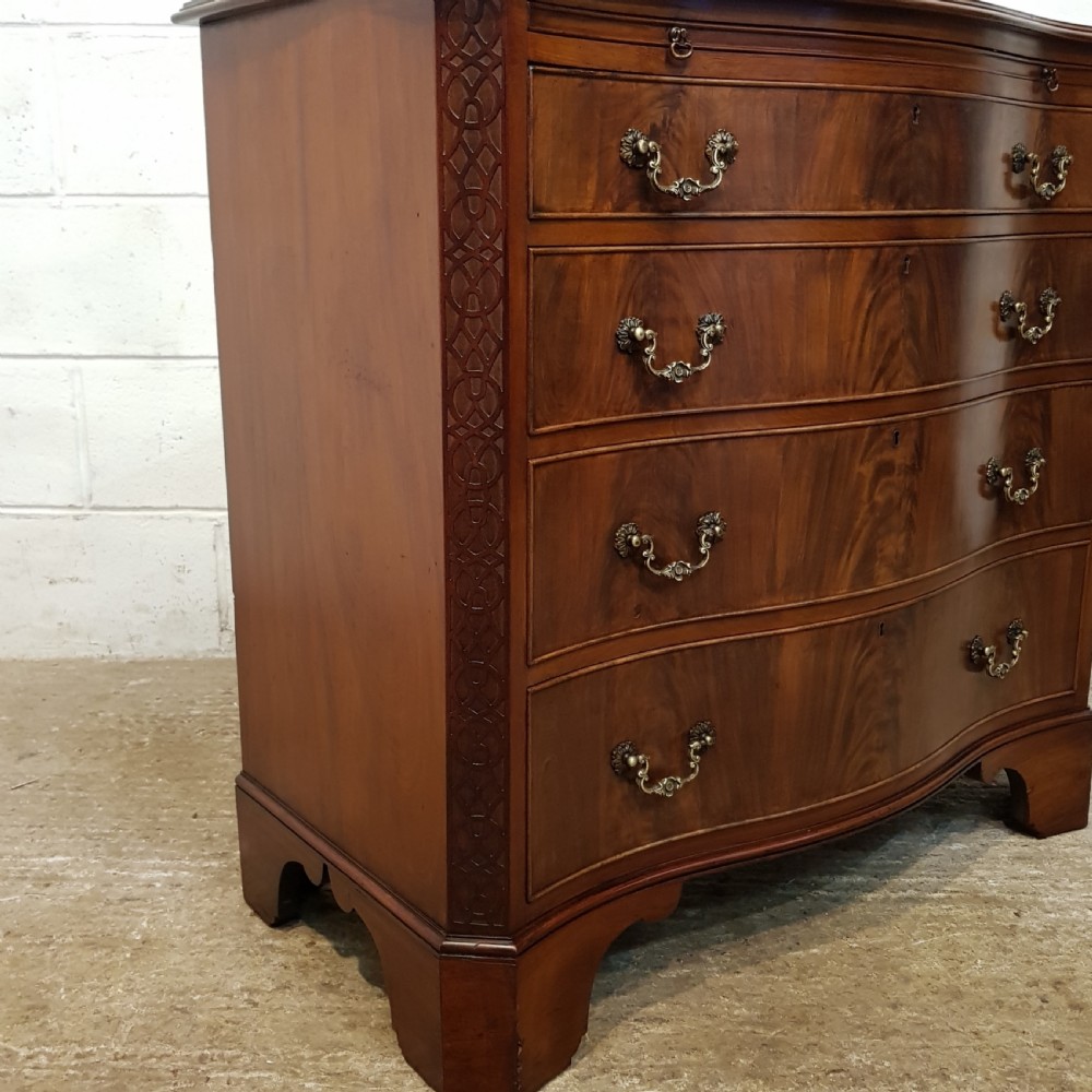 ANTIQUE MAHOGANY SERPENTINE FRONT CHEST OF DRAWERS WITH BRUSHING SLIDE C1920 View IV