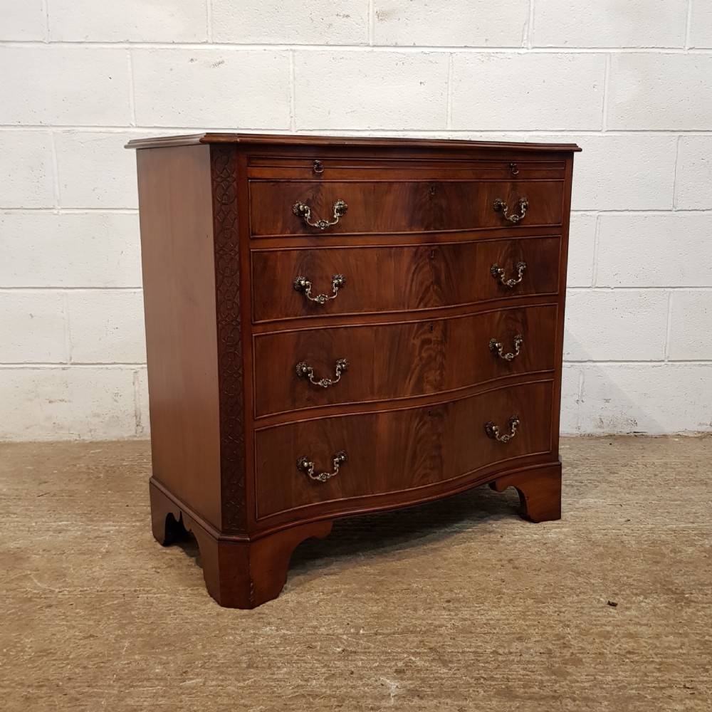 ANTIQUE MAHOGANY SERPENTINE FRONT CHEST OF DRAWERS WITH BRUSHING SLIDE C1920 View VI