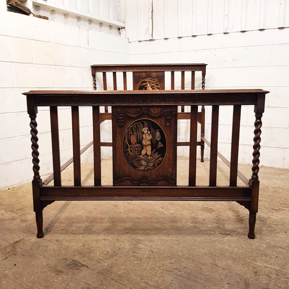 ANTIQUE CARVED OAK DOUBLE BED WITH JAPANNED OVAL PANELS C1920.