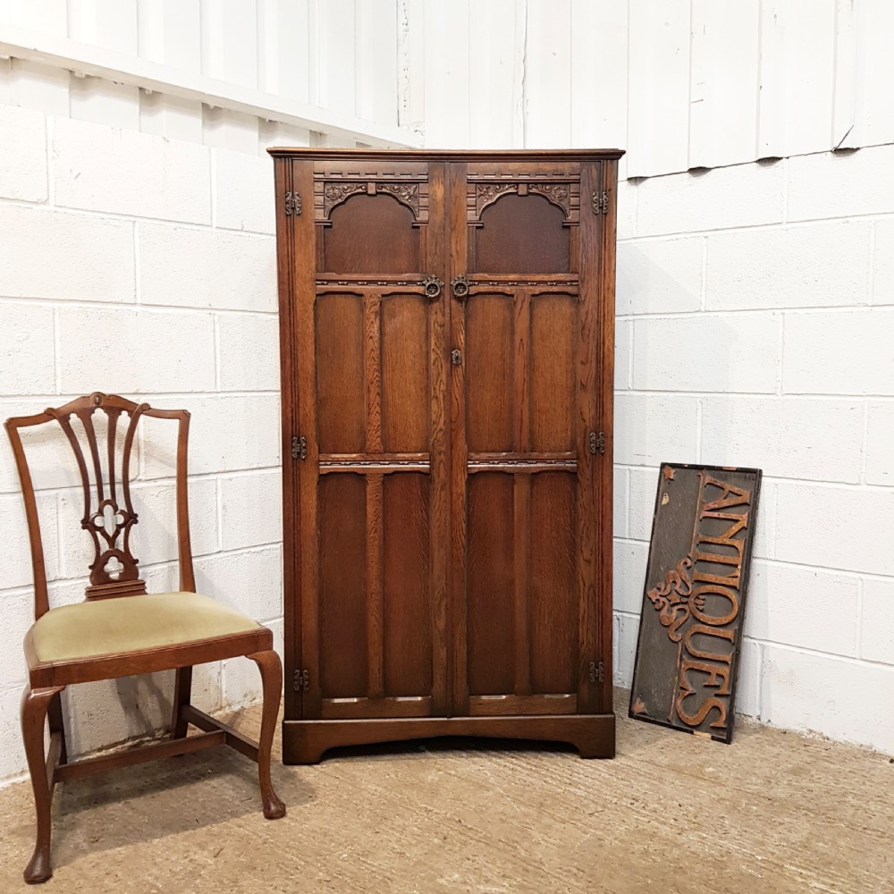 ANTIQUE CARVED OAK SMALL FITTED WARDROBE 61” HIGH C1920