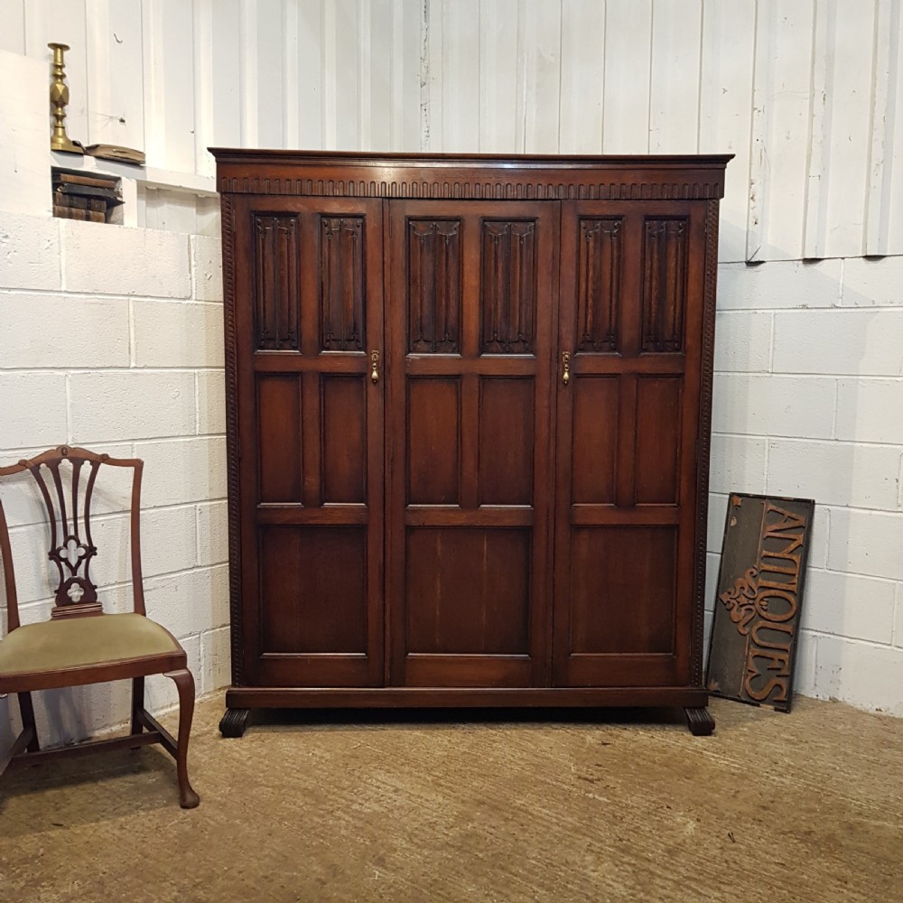 ANTIQUE SMALL OAK LINEN FOLD TRIPLE WARDROBE BY WARING & GILLOWS C1920