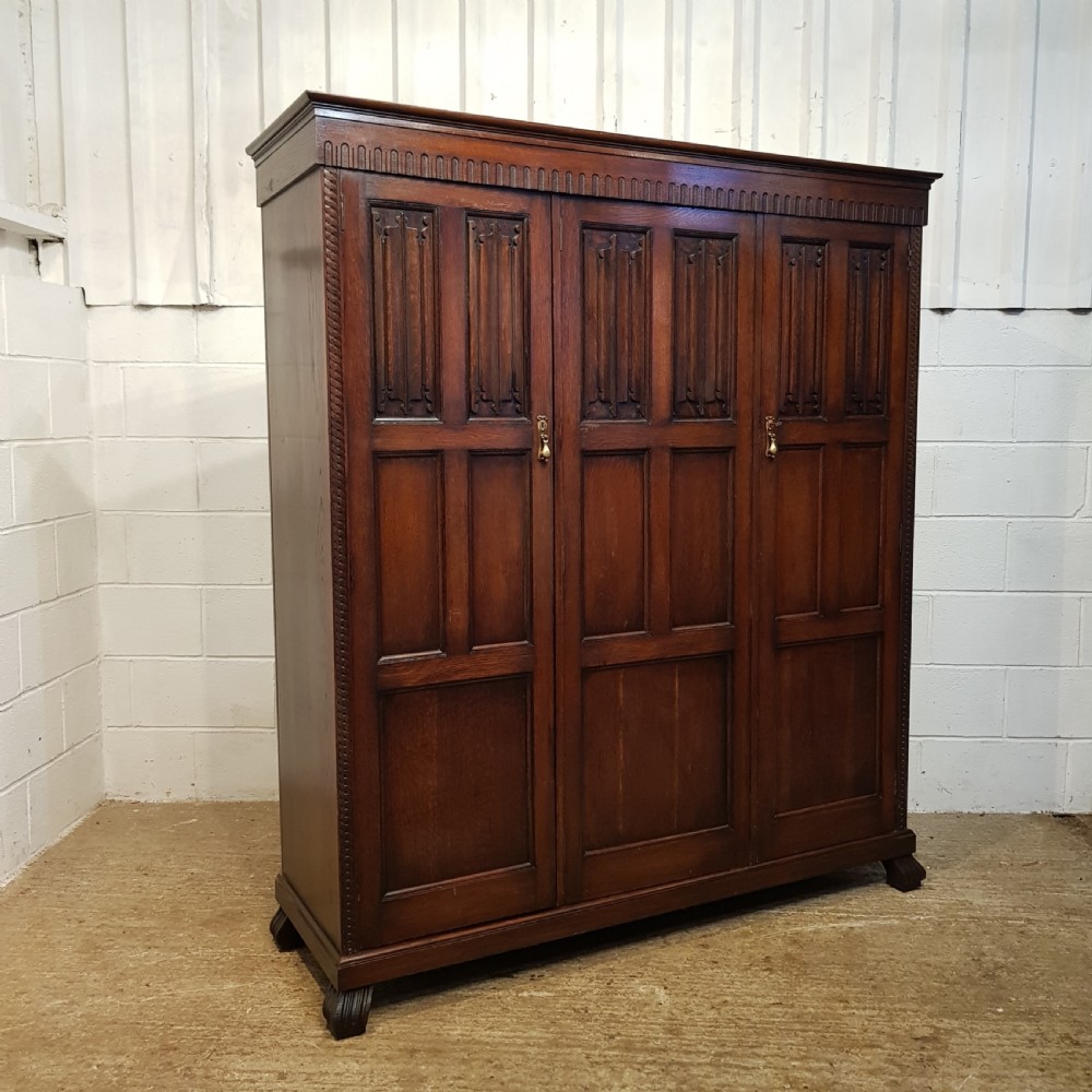 ANTIQUE SMALL OAK LINEN FOLD TRIPLE WARDROBE BY WARING & GILLOWS C1920 View III