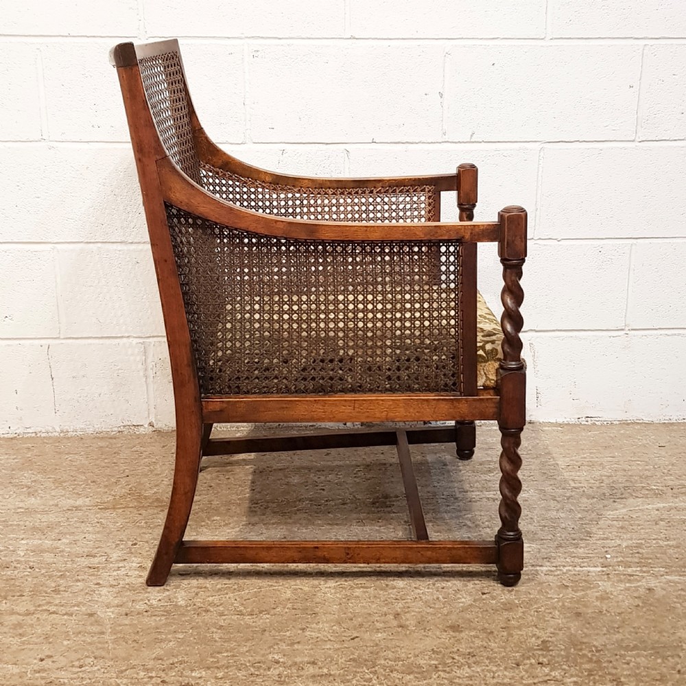 ANTIQUE WALNUT & OAK FRAMED BERGERE ARMCHAIR C1920
