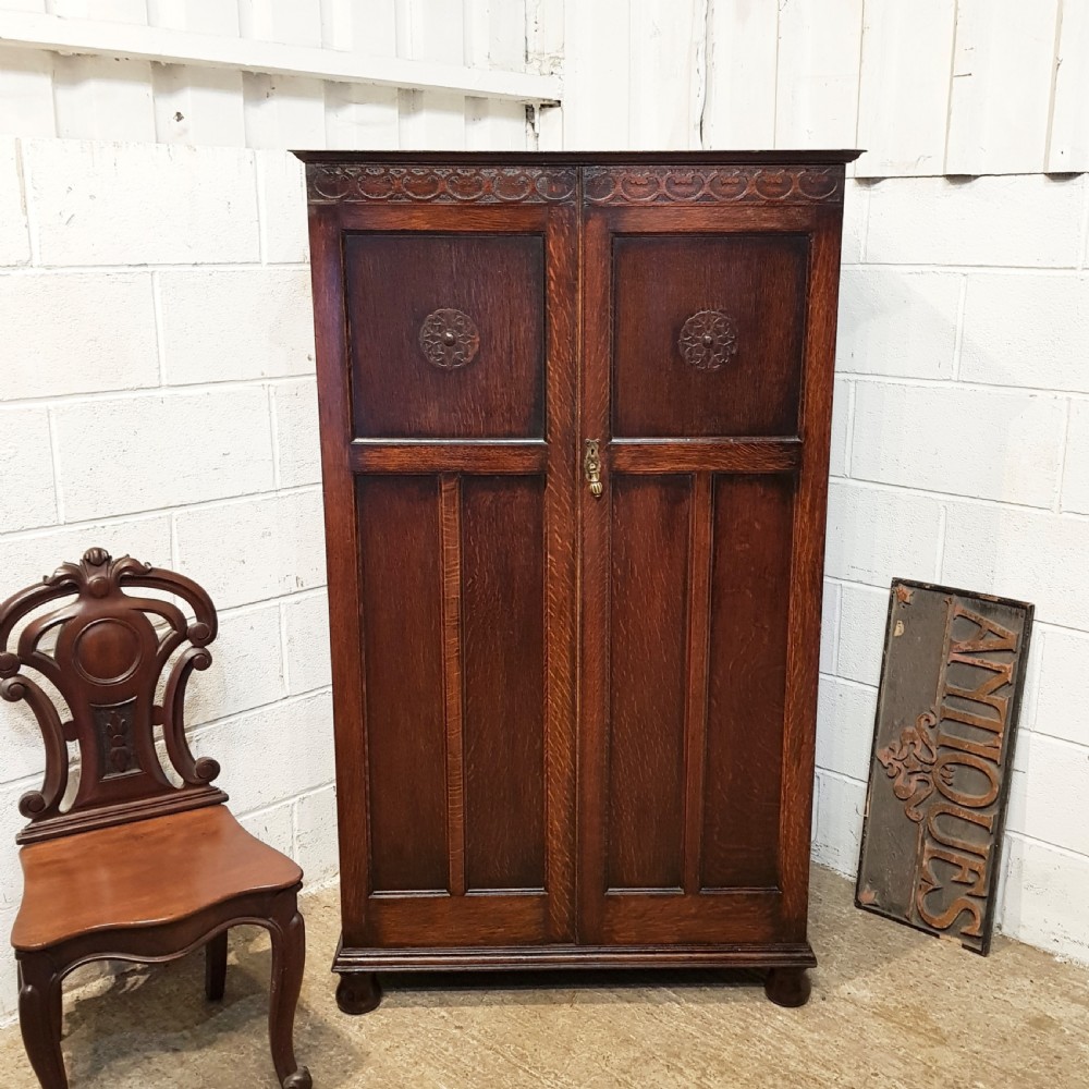ANTIQUE SMALL CARVED OAK WARDROBE C1920