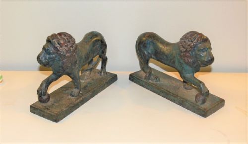 A Pair of Cold Painted Cast Iron Lions.