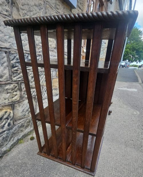 AN EDWARDIAN OAK REVOLVING BOOKCASE - ADDITIONAL PHOTO 4