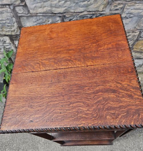 AN EDWARDIAN OAK REVOLVING BOOKCASE - ADDITIONAL PHOTO 5
