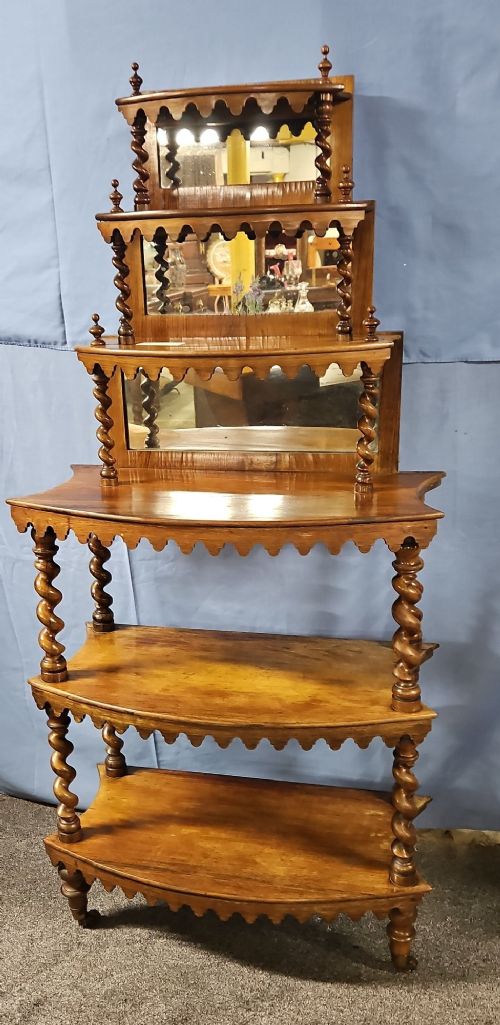 A multi-tiered Victorian rosewood etagere featuring barley twist supports, scalloped shelf aprons, and inset mirrored panels. View XI