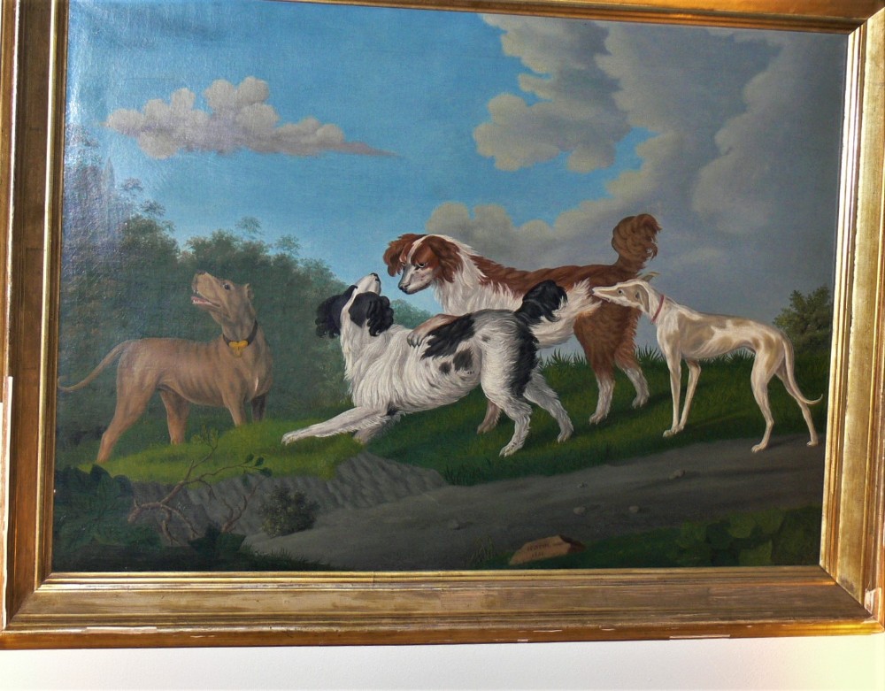 Hounds playing in a landscape.