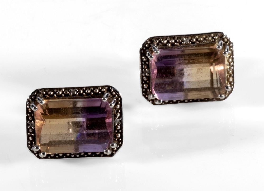 Amatreen and gold ear rings.