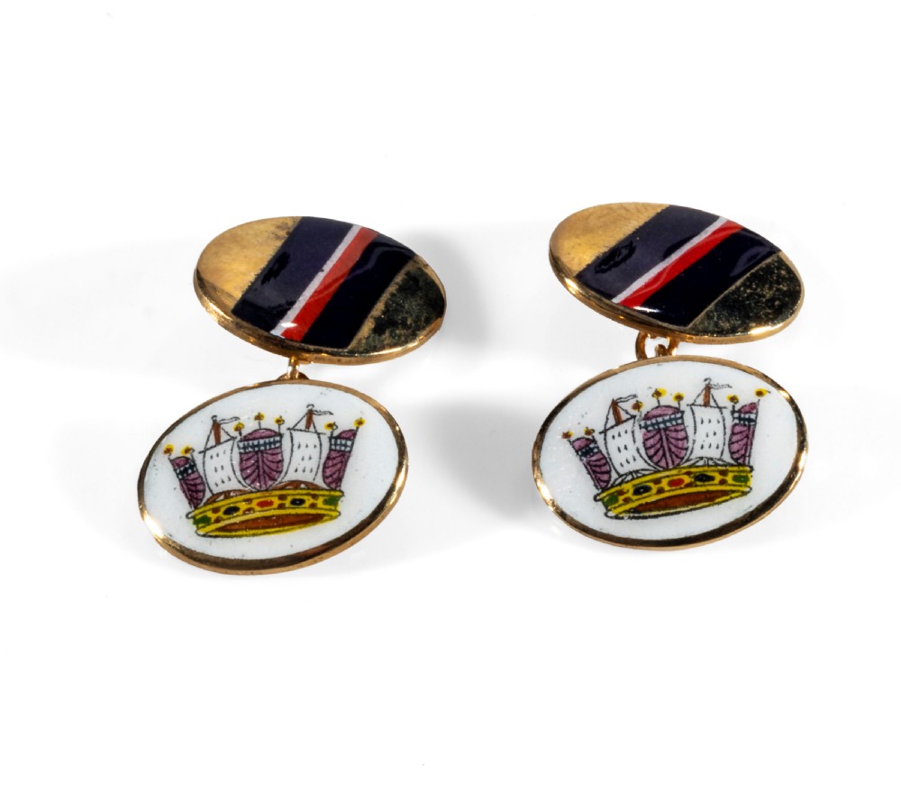 A pair of enamel and gold cuff links.
