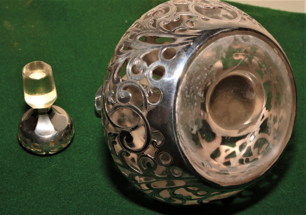  A glass and silver plated claret jug. View II