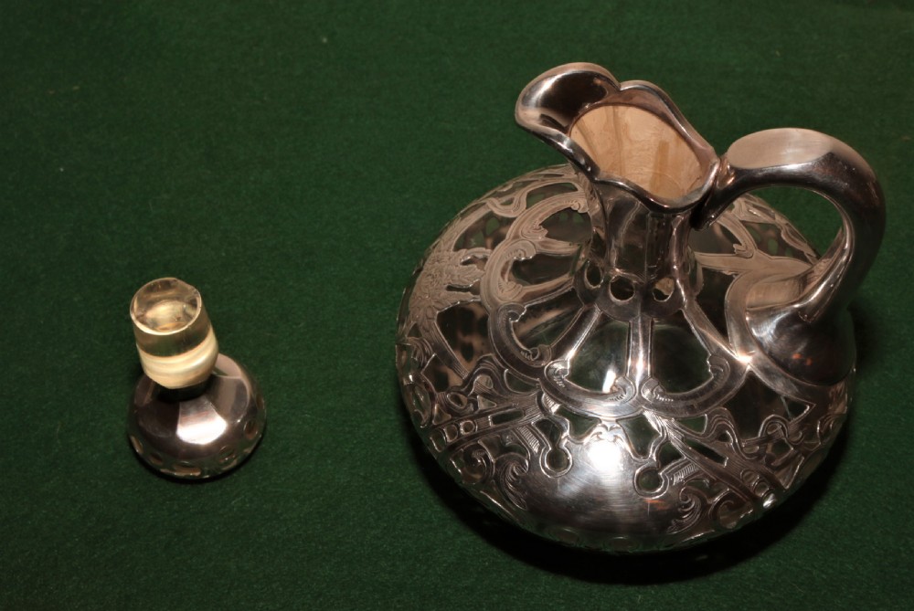  A glass and silver plated claret jug. View IV
