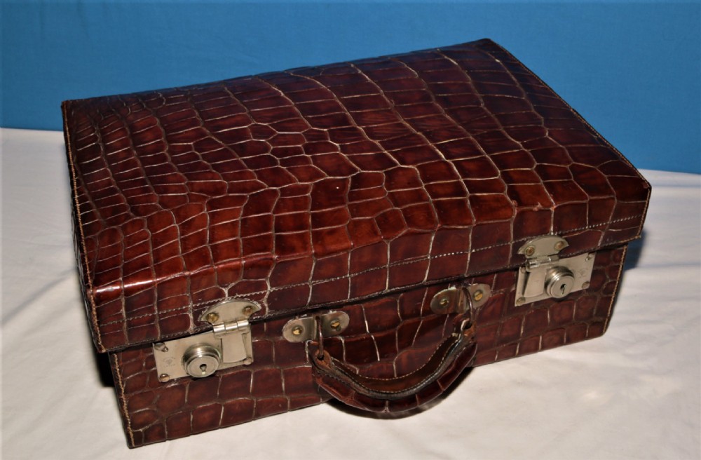 Crocodile suitcase fitted.