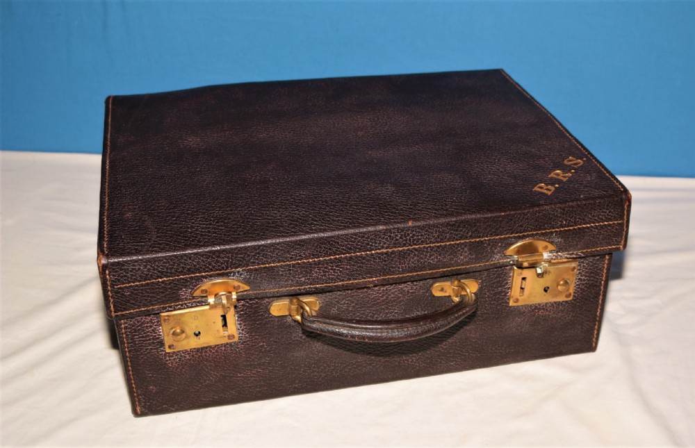 Fitted leather suitcase.