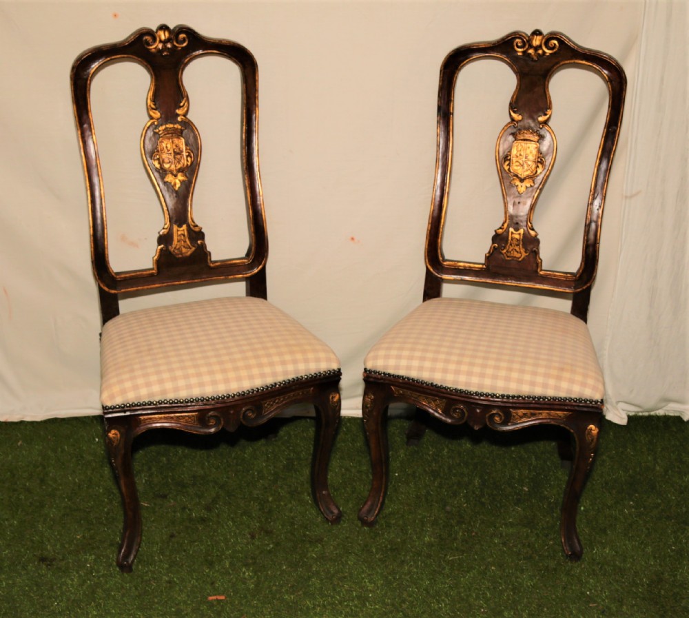 A pair of Italian walnut chairs.